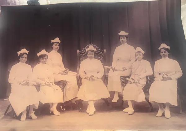 Nursing school graduation portrait. Tami’s great-grandmother, Maude Burkely-Tucker, is seated on the far right.
